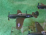 Bandai pre-painted P40N (Warhawk) (3). I replaced the aerial with brass rod, and inserted a brass rod into the bottom so it can sit in the flight...