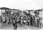 Members of the 11th Aero Squadron with their DeHavilland DH-4 aircraft at Amanty Airfield, France, 14 September 1918. Aircraft foreground, on the...