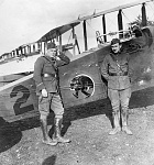 Capt Cecil G. Sellars (left), commander of the 20th Aero Squadron, and 1st Lt Joseph Wallach (right), squadron medical officer, pose with one of...