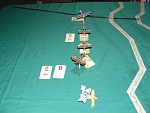 Turn 6c: Triplane performs an Immelmann coming into the neat line of aircraft. Shots fired by the Camel and Rumpler. Tailing positions also...