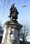 The Caproni passing the Albert Ball Statue in Nottingham, UK