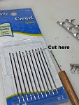 Super glue applicator made from sewing needle and dowel.