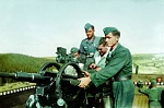 Karl Schutte stands at the back of an anti-aircraft gun (20mm) on the Mhne Dam