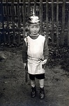 Jugendwehr / Kinderhelm 
 
Nothing on reverse. 
 
A young boy of no more than five years old wears a fabulous mite-sized replica of a Preuen M1895...