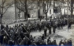 French and Belgian POWs are herded through the streets of Meschede enroute to the POW situated just outside the town 
 
Note on reverse "Meschede"...