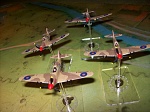 Arii 1/144 model kits. Desert Hurricanes, painted and "pilots added.