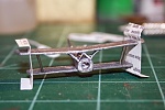 Step 6  was to use wire to form the inter-plane struts.  I pushed .022m wire through the top and glued to the bottom wing.