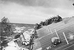 Light carrier U.S.S. Langley experiencing a 70 degree roll in typhoon