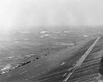 Another carrier taking a precarious roll in heavy seas of Typhoon Cobra