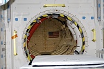 Open hatch on the mid-deck for the crew transfer tunnel.