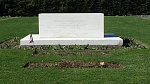 The graves of Franklin and Eleanor Roosevelt (FDR's has a flag on it). Behind the tombstone a short distance away is the burial site of their beloved...