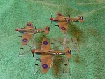 21st Century pre-painted Supermarine Spitfire Mk VIII (5). The minis were in 3 different colours, 2 were in Desert camo and the third was pink. I...