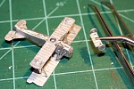 11.  You might need to drill out the holes first in the wheels & axle base.  Two methods here: 
 
a.  Then assemble the landing gear struts, axle and...