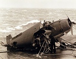 Crew members work desperately to save plane on flight deck during Typhoon Cobra