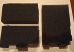 The cut foam, shaped to match the inside of the plano box.