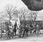 1918 photograph of US Army observation balloon of the caquot style.  This is a zoom of the gondola with its passengers. The image has been sharpened...