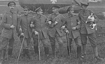 great close up of this group image - note the pipe, ribbons, and of course the dog!